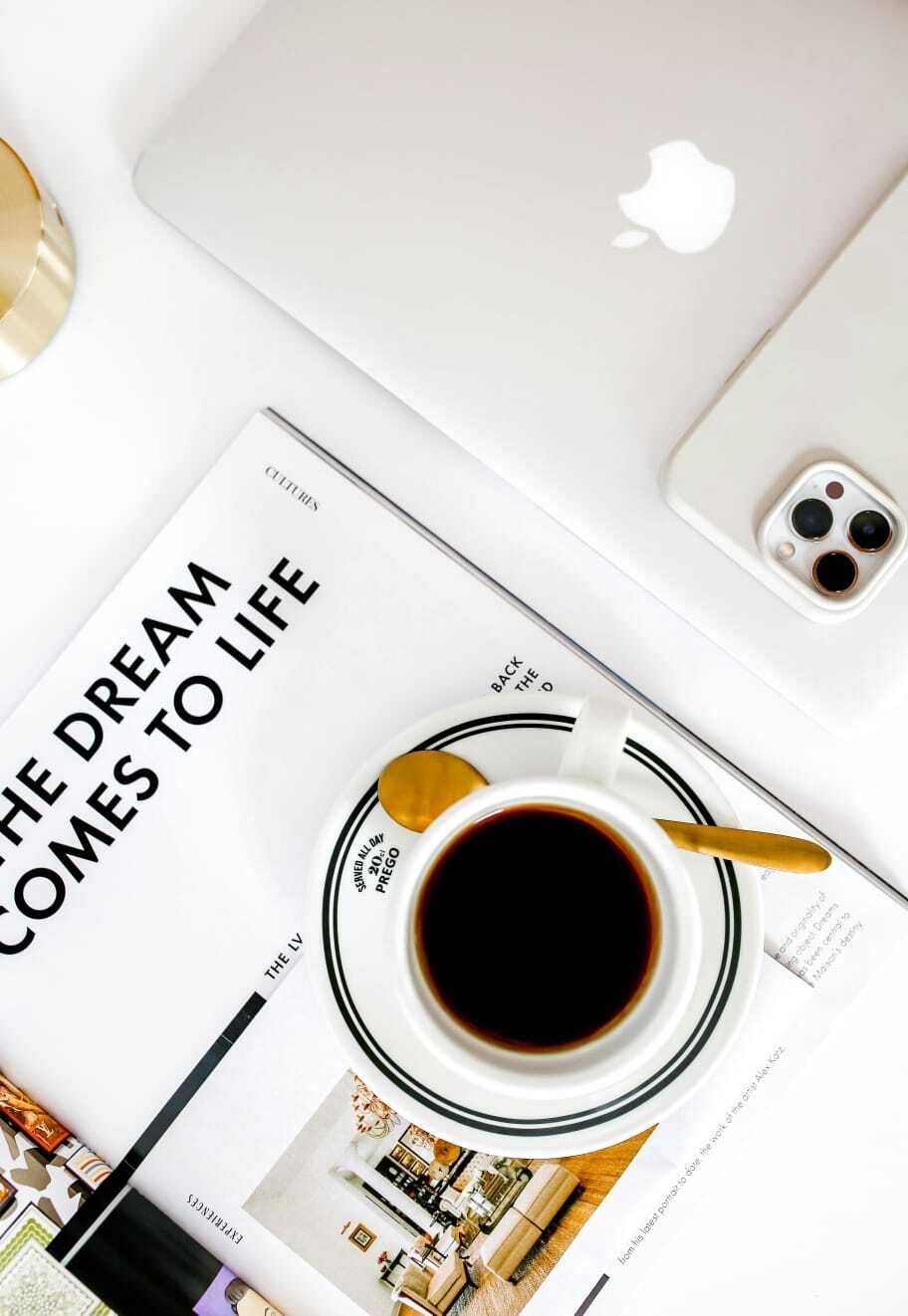 coffee, laptop and phone on a table